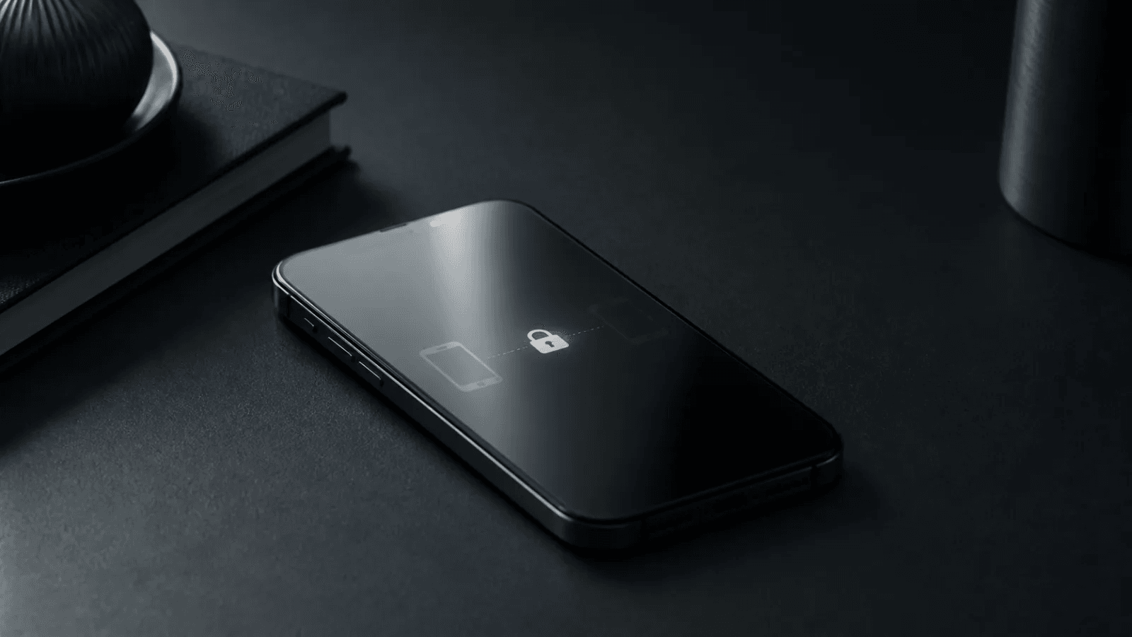 A phone on a dark desk with a lock between two device outlines, representing a device-specific encrypted conversation.